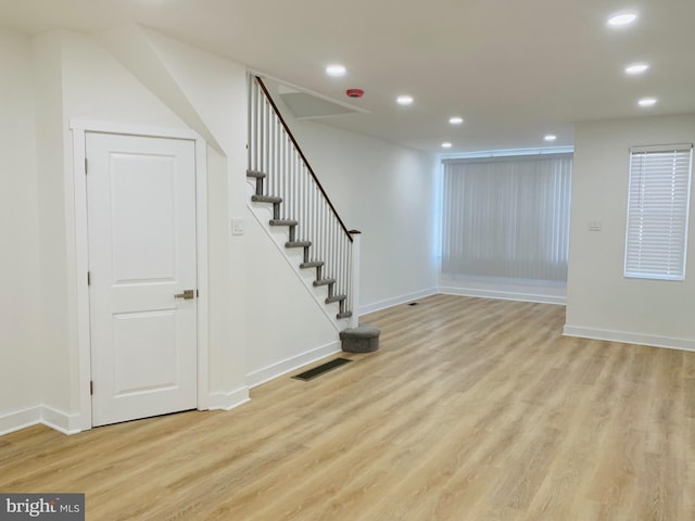 basement featuring light wood-type flooring