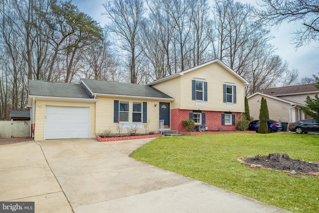 split level home featuring a front yard and a garage