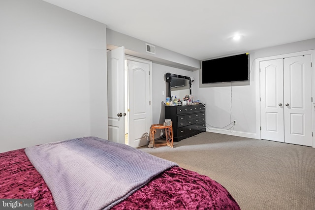 carpeted bedroom featuring a closet