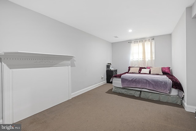 bedroom with dark carpet