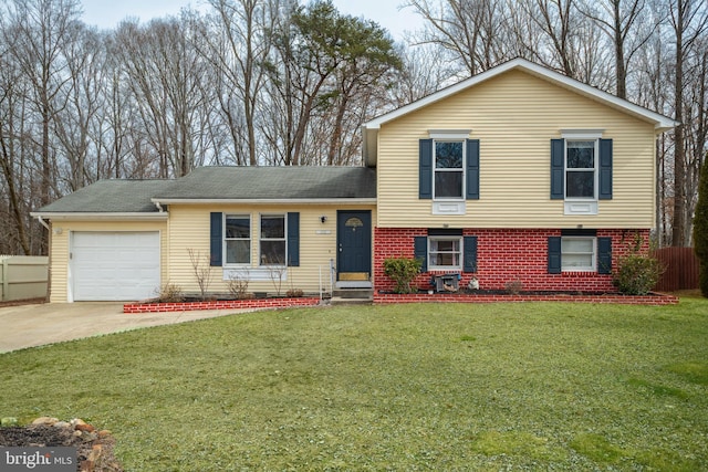 tri-level home with a front lawn and a garage