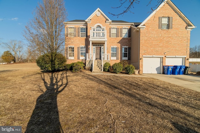 view of front of property featuring a garage and a front yard