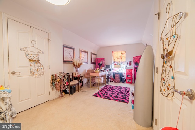 playroom featuring vaulted ceiling and carpet flooring