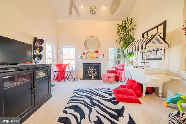 game room featuring high vaulted ceiling and carpet floors