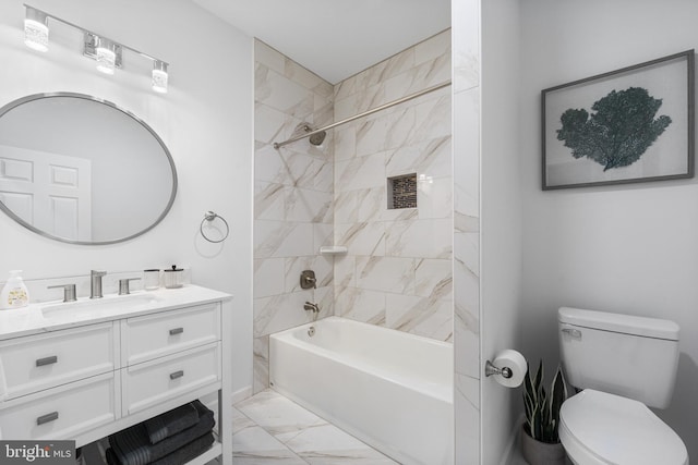 full bathroom with vanity, toilet, and tiled shower / bath combo