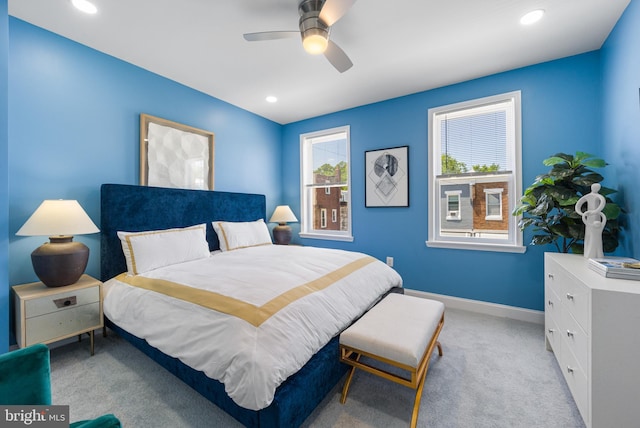 bedroom with light carpet and ceiling fan