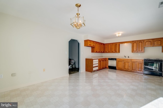 kitchen featuring pendant lighting, sink, range with electric stovetop, stainless steel dishwasher, and a chandelier