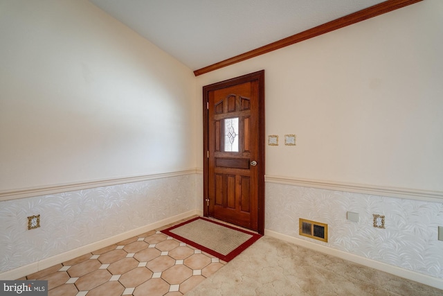 carpeted foyer entrance with lofted ceiling