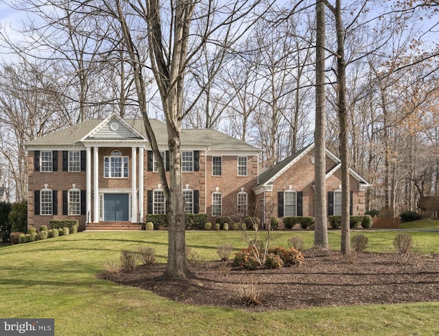 greek revival house with a front yard