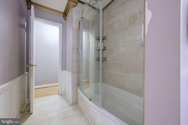 bathroom featuring bath / shower combo with glass door and tile patterned floors