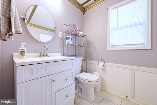 bathroom featuring crown molding, vanity, toilet, and tile patterned flooring