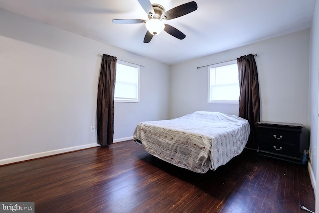 bedroom with ceiling fan and dark hardwood / wood-style flooring