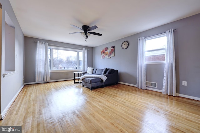 unfurnished room with ceiling fan and light hardwood / wood-style floors