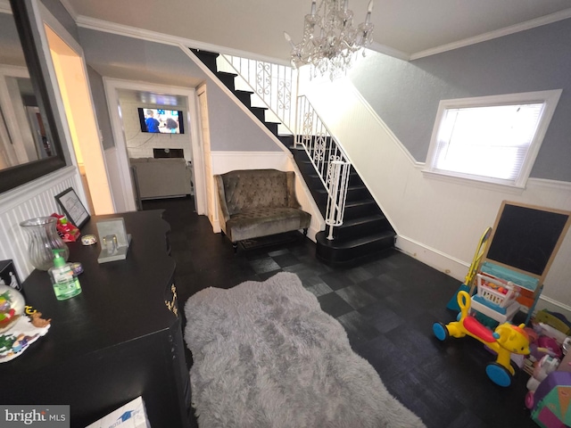 stairs featuring a notable chandelier and crown molding