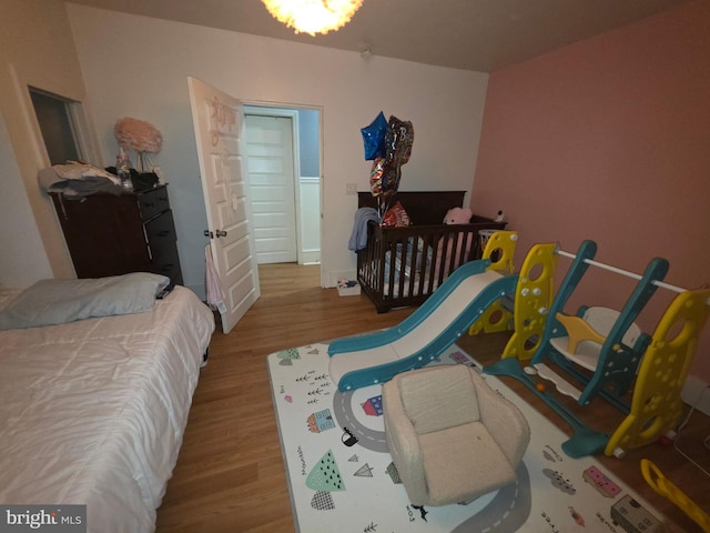 bedroom with light hardwood / wood-style flooring