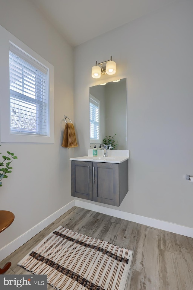 bathroom featuring vanity and hardwood / wood-style floors