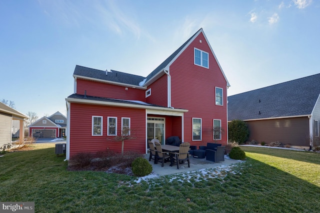 back of property with a patio, a yard, and central AC