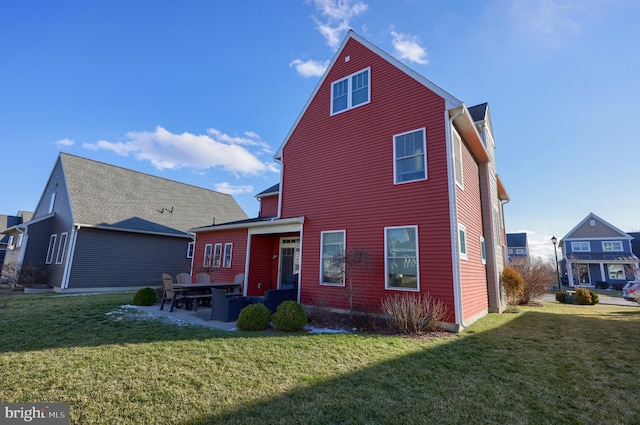 back of property with a patio and a lawn