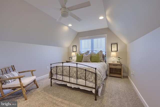 bedroom featuring lofted ceiling, light carpet, and ceiling fan