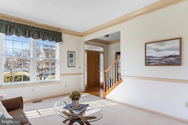 interior space with ornamental molding and light carpet