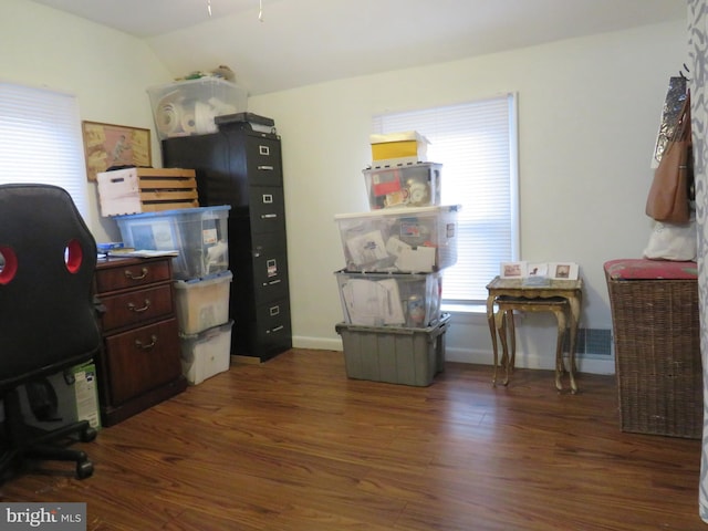 office with lofted ceiling and dark hardwood / wood-style floors