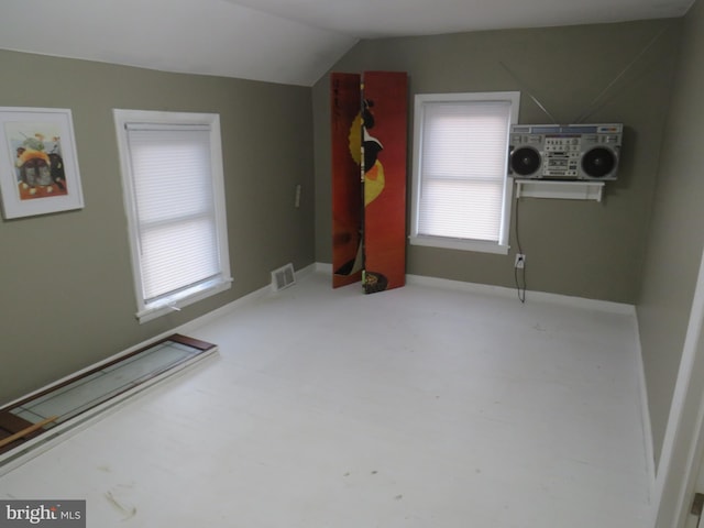 additional living space featuring vaulted ceiling