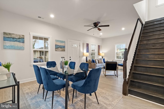 dining area with stairway, recessed lighting, visible vents, and light wood-style floors