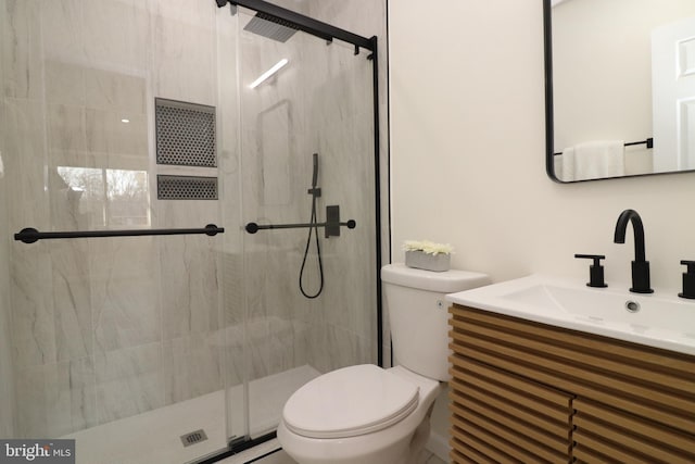 bathroom with vanity, toilet, and walk in shower