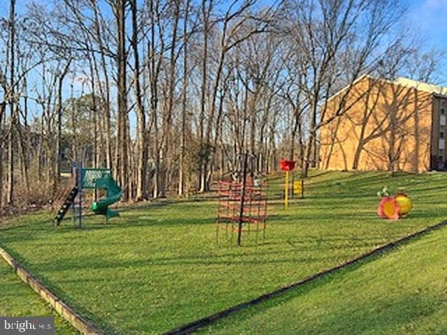 exterior space featuring a lawn and a playground