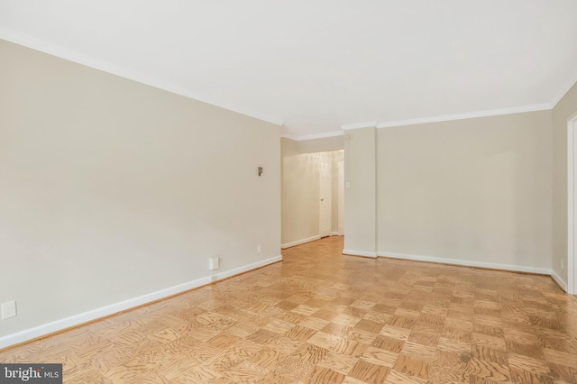 empty room with light parquet floors and ornamental molding