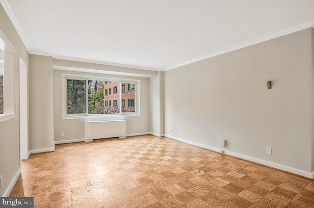 spare room with light parquet floors, crown molding, and radiator heating unit