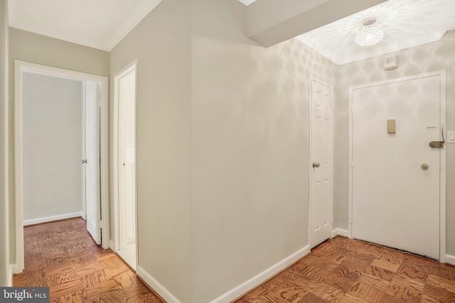 corridor featuring crown molding and light parquet floors