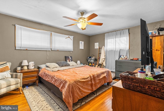 bedroom featuring ceiling fan and light wood-type flooring