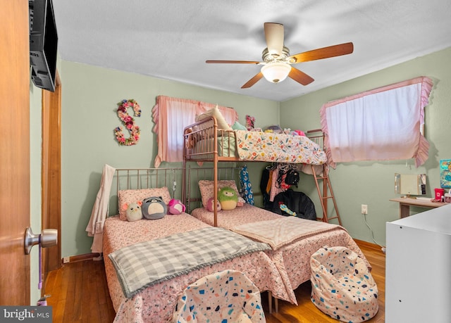 bedroom featuring hardwood / wood-style floors and ceiling fan