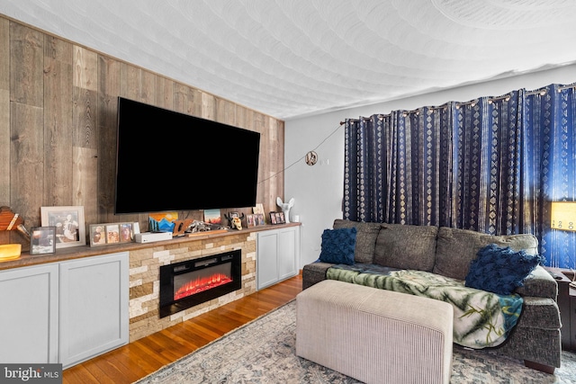 living room featuring wooden walls and light wood-type flooring