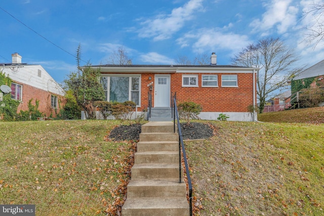 view of front of property with a front lawn