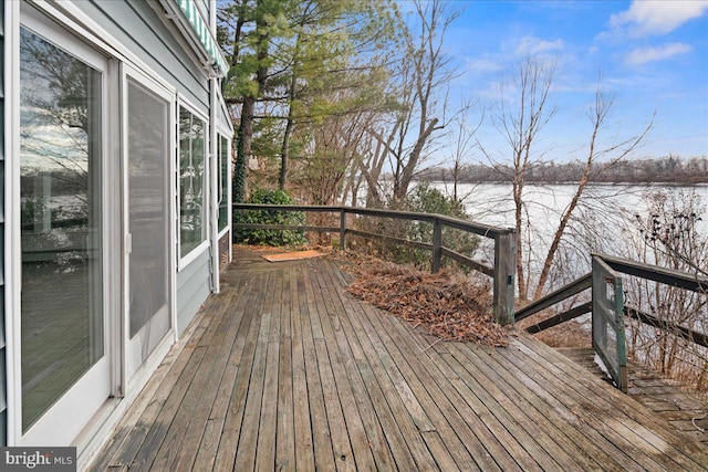 wooden deck featuring a water view