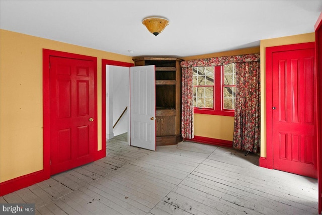 spare room featuring baseboards