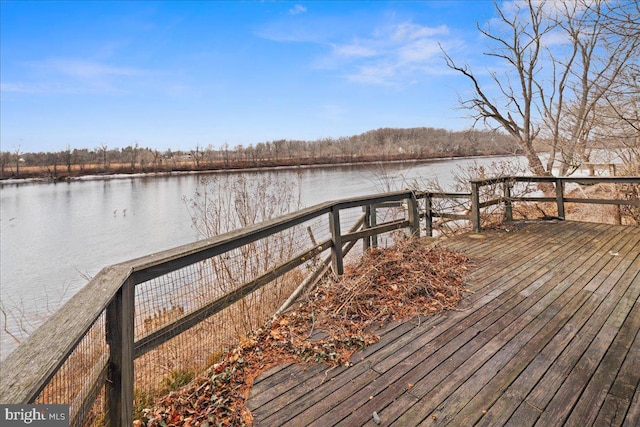 view of dock with a deck with water view