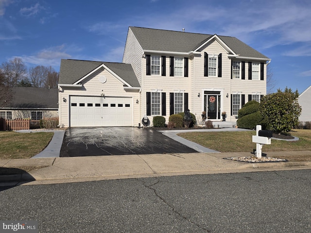 colonial house featuring a garage