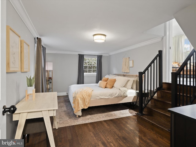 bedroom featuring ornamental molding and dark hardwood / wood-style floors