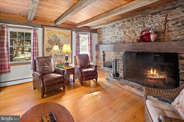 living room featuring wood ceiling, a baseboard radiator, a fireplace, and light wood-style flooring