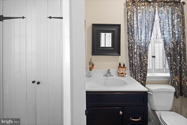 bathroom with vanity and toilet