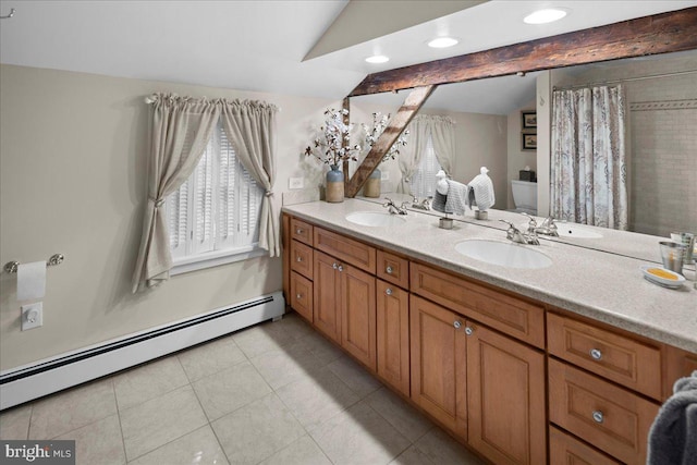 bathroom featuring a baseboard heating unit, double vanity, a sink, and vaulted ceiling with beams