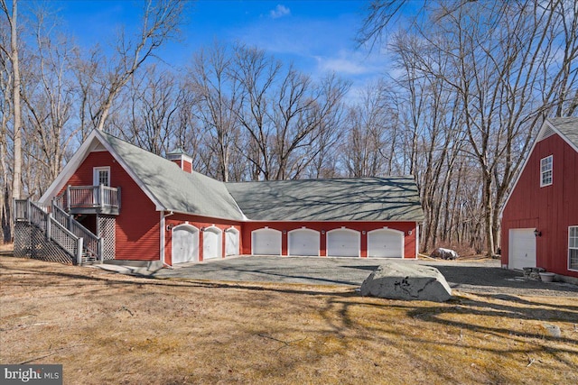 exterior space with gravel driveway