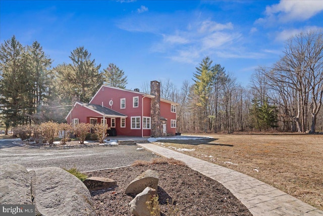 view of front of home featuring a chimney