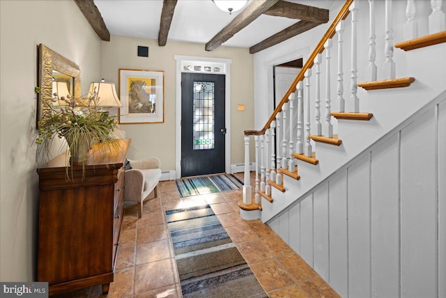 foyer with stairway, beamed ceiling, and a baseboard radiator