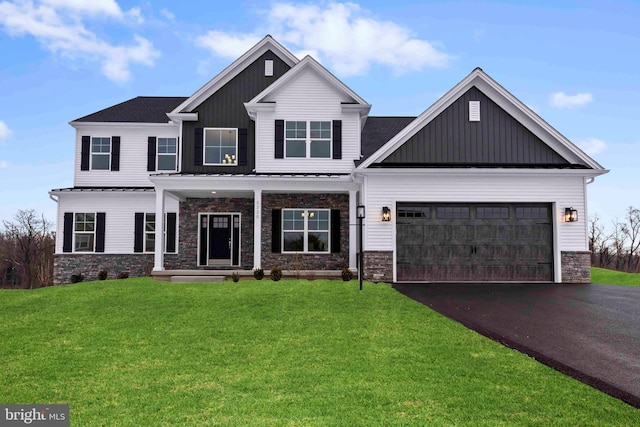 view of front facade with a garage and a front yard