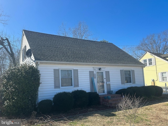 view of front of home featuring a shingled roof