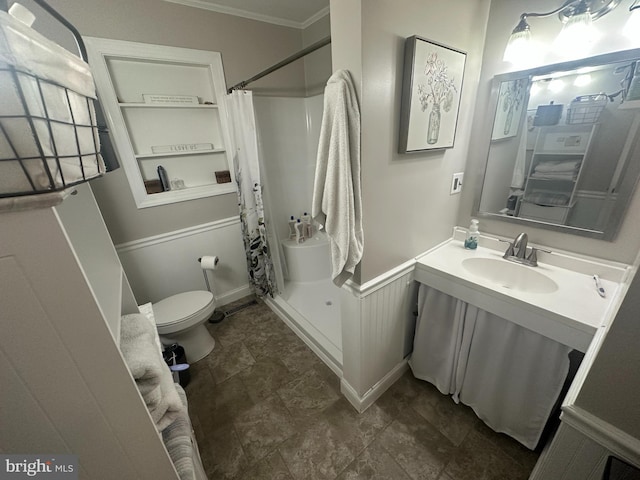 full bathroom with toilet, a stall shower, ornamental molding, and vanity